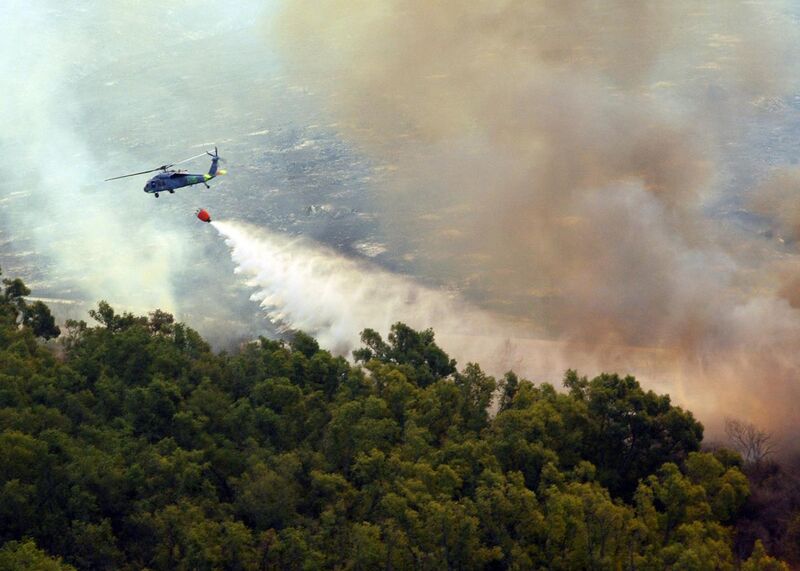 File:MH-60S Helicopter dumps water onto Fire.jpg
