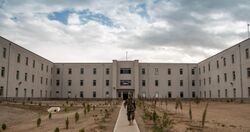 An Afghan National Defense University (ANDU) instructor exits an academic hall at the school in Kabul, Afghanistan, May 7, 2013 130507-F-OF869-007.jpg