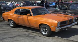 1973 Pontiac Ventura Sprint Coupe 350 in orange, front right.jpg