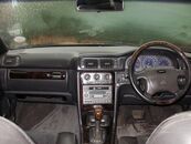 Interior view of the dashboard of an RHD V70 R with anthracite interior and walnut wood trim