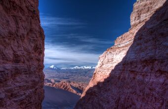 view of high desert through a mountain crevasse