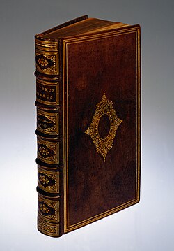 A 19th-century book with a gilded brown leather cover