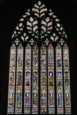 A very large window of eight lights rising to elaborate tracery in the form of a sacred heart