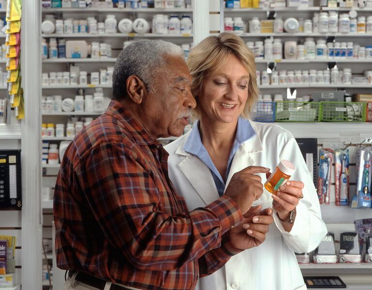 File:Man consults with pharmacist.jpg