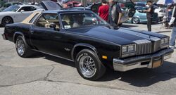 1977 Oldsmobile Cutlass Supreme Brougham coupe at Belmont, front right.jpg