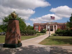 Oklahoma Baptist University Campus Oval Bison Monument and Shawnee Hall.jpg