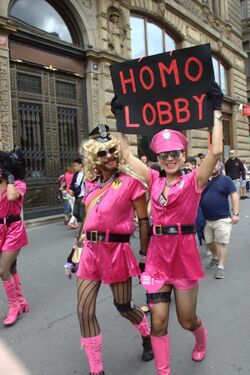 Marchers at Prague Pride 2017 carry a satirical "Homo Lobby" sign