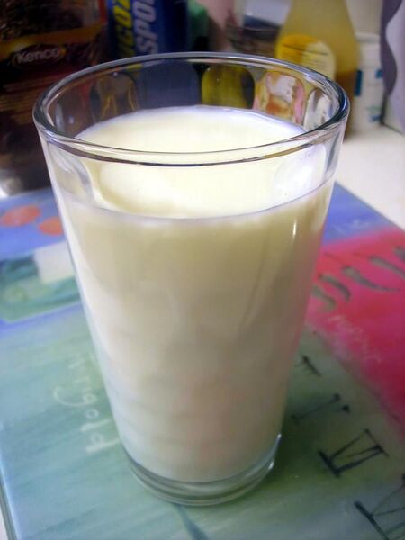 File:Glass of milk on tablecloth.jpg