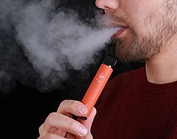 Aerosol (vapor) exhaled by an e-cigarette user.