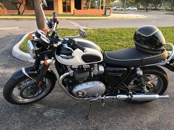 Mainly black motorcycle with white accents parked in Florida