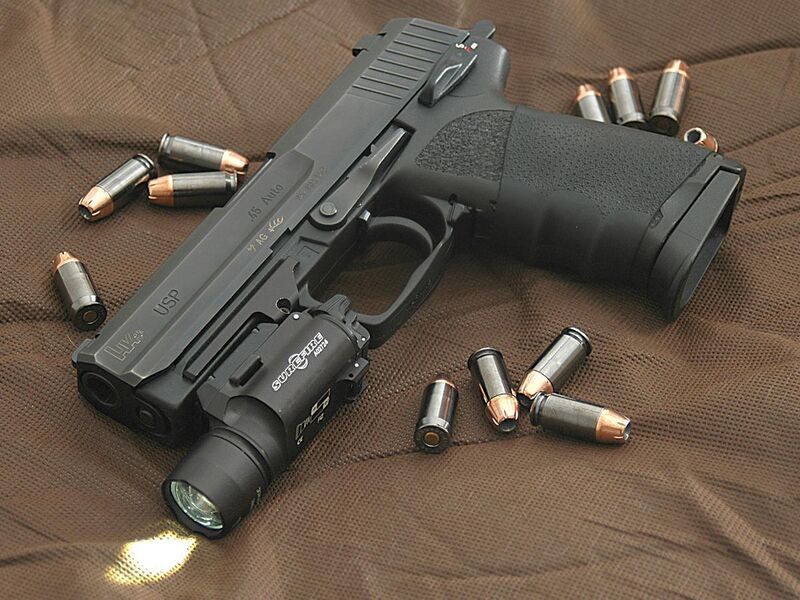File:HK USP 45 surrounded by .45 caliber Hornady TAP (+P) jacketed hollow point rounds.jpg