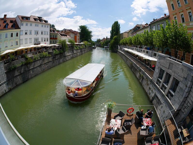 File:Ljubljana old town with excursion boat.JPG