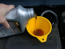 Motor oil refill with funnel.JPG