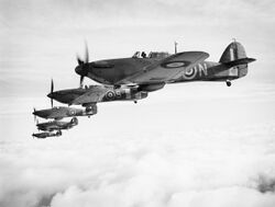 Hawker Sea Hurricanes of the Fleet Air Arm, based at RNAS Yeovilton, flying in formation, 9 December 1941. A9534.jpg