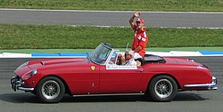 Photograph of Michael Schumacher in a Ferrari 250 GT Cabriolet Pinin Farina on the occasion of the drivers' parade at Hockenheim in 2004.