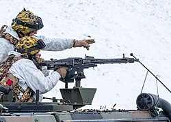 Italian Army - 2nd Alpini Regiment troops firing a MG42 machine gun from a VTML Lince vehicle during a training exercise in Valloire, France.jpg