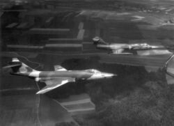 Camouflaged West German RF-104G and RF-104G flying in formation