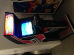 An arcade cabinet with handlebars