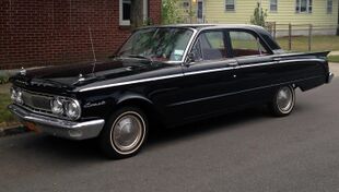 1962 Mercury Comet 4-door sedan (black, front left).jpg