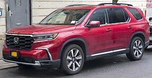 2023 Honda Pilot Touring in Radiant Red, front left (cropped).jpg