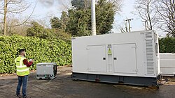 An operator controlling a resistive 200kW Avtron load bank being used to test a diesel generator.