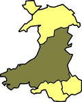 A map of Wales in yellow with a large area in green (about 60%) from the right (east) to the bottom left (south west)