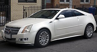 2011 Cadillac CTS-4 Coupe Premium in White Diamond Pearl, front left.jpg