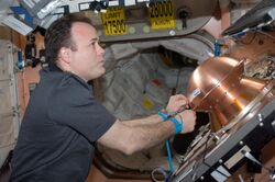 ISS-28 Ron Garan prepares the Reentry Breakup Recorder.jpg