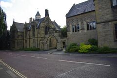 A picture of the front of Durham School taken from the road outside, illustrating the Kerr Arch in the centre.