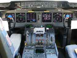 Cockpit of McDonnell Douglas MD-11 (5306565461).jpg