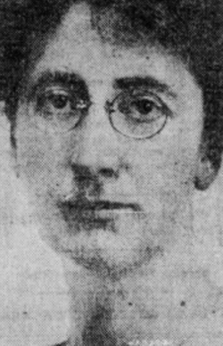 A white woman wearing round eyeglasses.