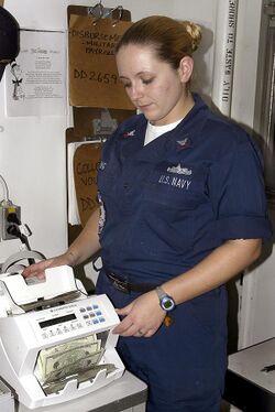 US Navy 040616-N-4973G-031 Disbursing Clerk 2nd Class Danielle King of Newport News, Va., electronically counts money in the disbursing office aboard USS John C. Stennis (CVN 74).jpg