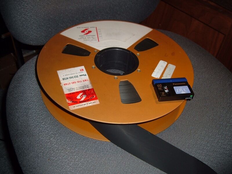 File:2-inch Quad Tape Reel with miniDV cassette.jpg