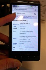 A Motorola Droid X showing an Android 2.3 home screen