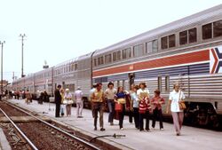 PASSENGERS OF THE SOUTHWEST LIMITED STROLLING BESIDE THE AMTRAK TRAIN AT ALBUQUERQUE, NEW MEXICO, AS IT HALTS FOR... - NARA - 555985 (cropped).jpg