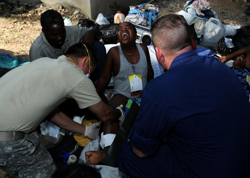 File:US Navy 100119-N-7948C-048 A Haitian woman screams in pain as U.S. military medical personnel try to set her broken leg at a clinic at the Killick Haitian Coast Guard Base.jpg