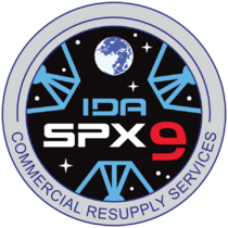 NASA's SpX-9 mission patch graphic simulates the view from inside IDA-2, displaying the three petals of the docking adapter.