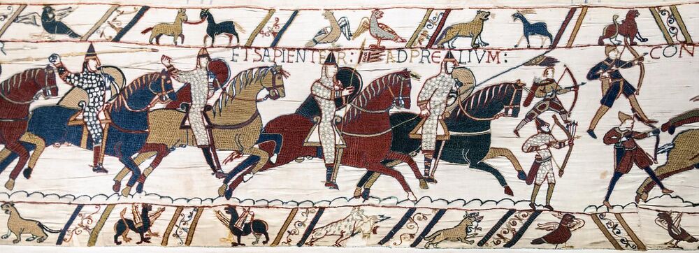 Norman archers depicted in the Bayeux Tapestry. The top left archer was caught unprepared and has hastily thrown his belt quiver about his shoulders, as well as forgetting his helmet.