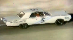 White Chrysler Turbine Car with a number on its side