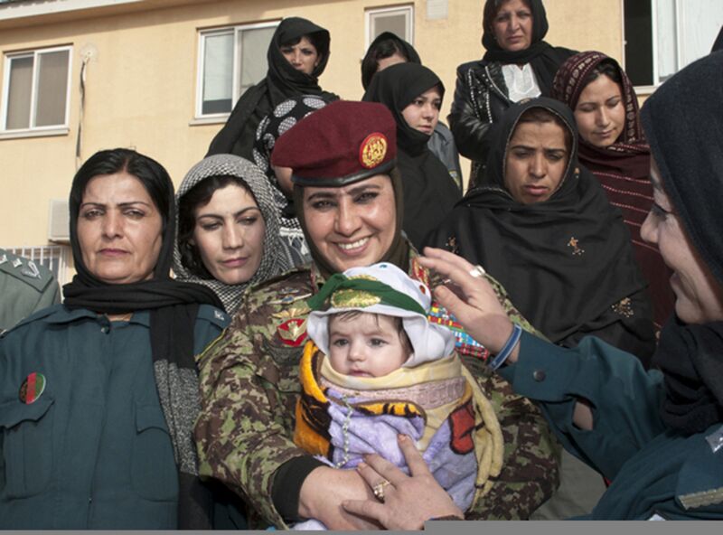 File:Afghan National Army (ANA) Brig. Gen. Khatool Mohammadzai, center, the director for women's affairs and the deputy director for the education and physical training within the ANA, poses with a group of 120220-A-WI966-673.jpg