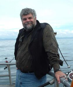 a picture of a bearded man on a fishing boat
