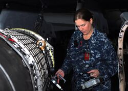 US Navy 110401-N-GL340-041 Machinist's Mate 1st Class Margaret Huff checks a jet engine for radiation.jpg