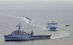 US Navy 110509-N-KB563-512 The amphibious transport dock ship USS Cleveland (LPD 7) leads a formation of ships.jpg