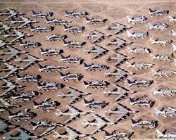 Aerial view of B-52s and other aircraft slowly being scrapped in the desert.