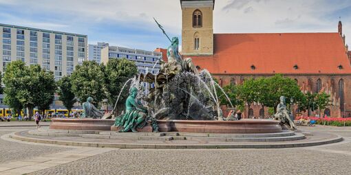Neptune fountain, with a church in the background