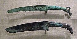 Shang dynasty curved bronze knives with turquoise inlays and animal pommel. 12th-11th century BCE.jpg