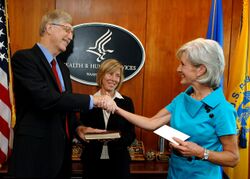 Francis Collins with Kathleen Sebelius after swearing-in ceremony.jpg