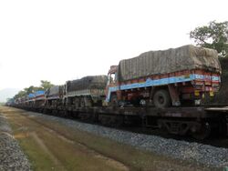 Train Carrying Trucks in Konkan Railway.jpg