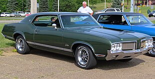 1970 Oldsmobile Cutlass Supreme Holiday Coupe, front right, 06-21-2023.jpg