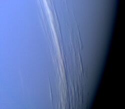 A composite black-and-white photograph showing cirrus clouds over the surface of Mars